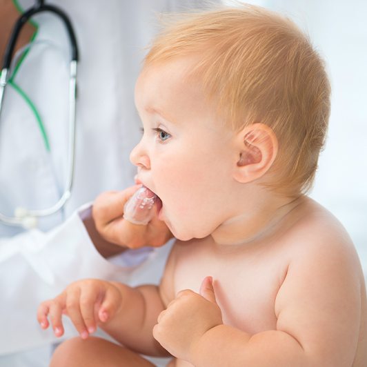 Dentist checking baby's teeth