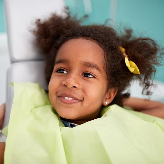 Little girl smiling after fenectomy