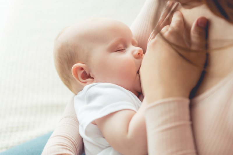 a mother breastfeeding her baby