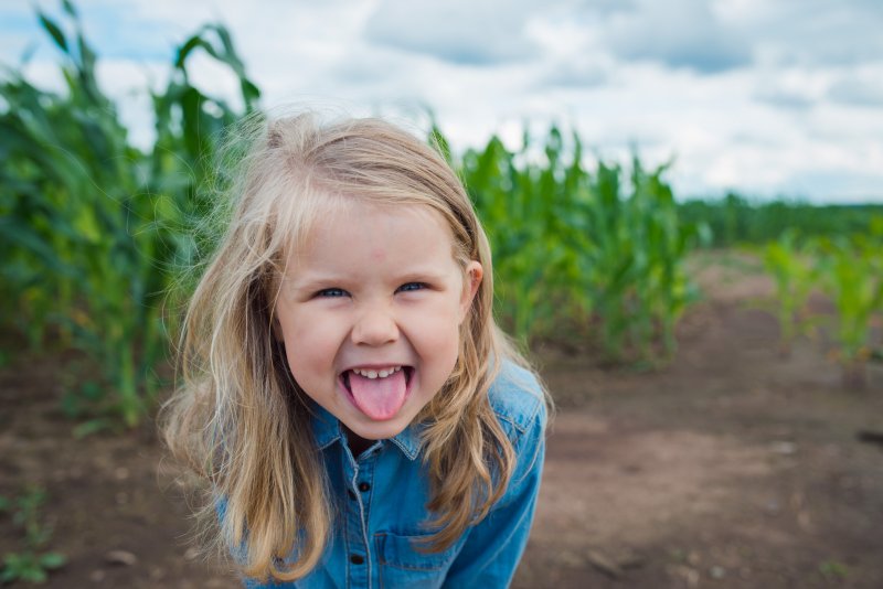 little girl sticking her tongue out