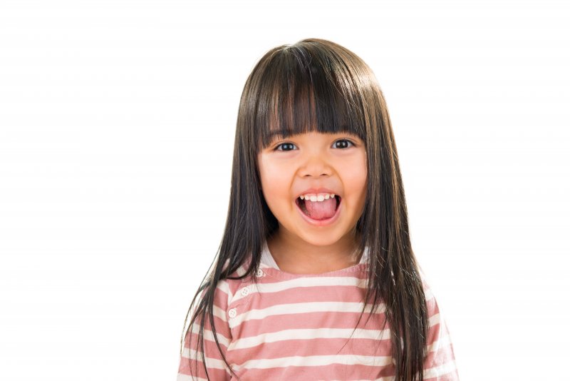 a little girl smiling