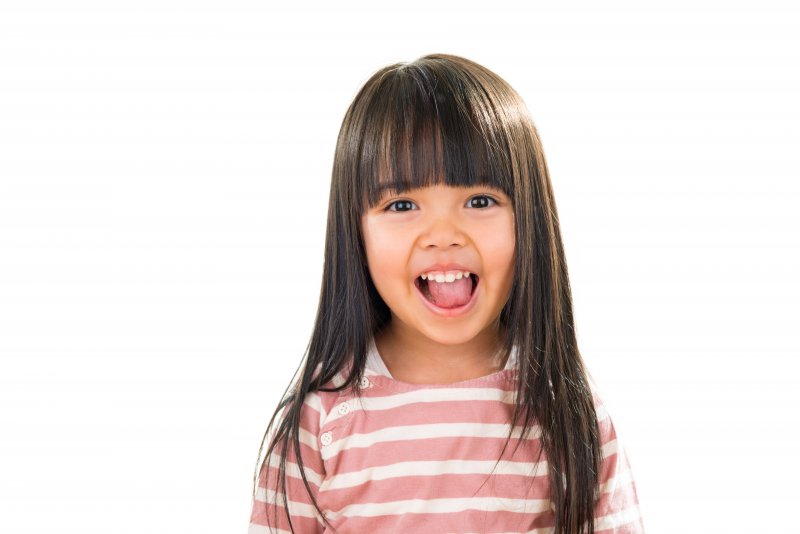 a little girl smiling 