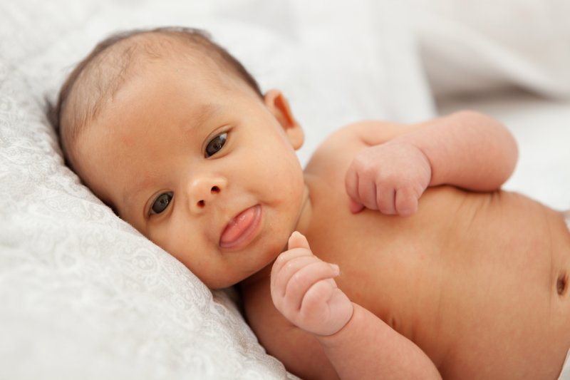 a baby with its tongue out