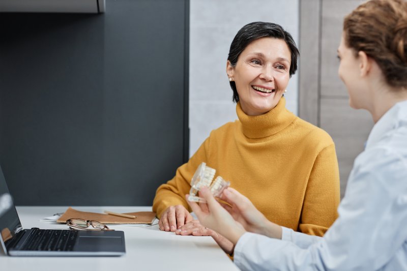 Dentist talking to mother about a frenectomy