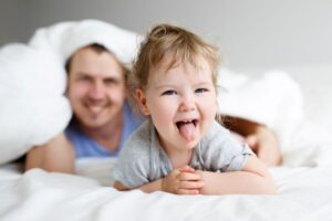 Playful child sticking out their tongue